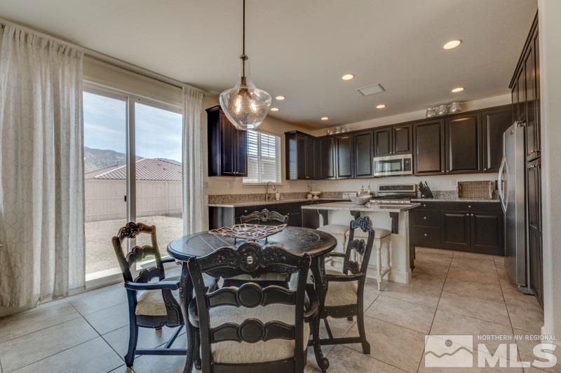 10602 Washington Reno, NV 89521 - Photo 11 of 25 a large kitchen with a table and chairs
