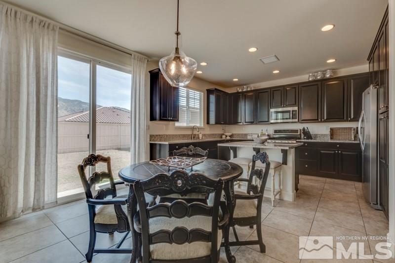 10602 Washington Reno, NV 89521 - Photo 13 of 25 a large kitchen with a table and chairs