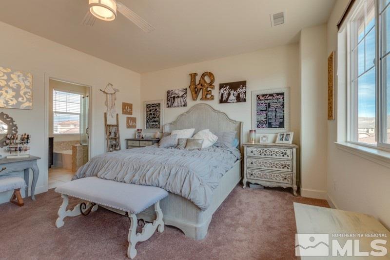 10602 Washington Reno, NV 89521 - Photo 17 of 25 a bedroom with a bed and wooden floor