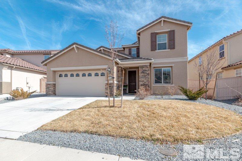 10602 Washington Reno, NV 89521 - Photo 2 of 25 a front view of a house with a yard