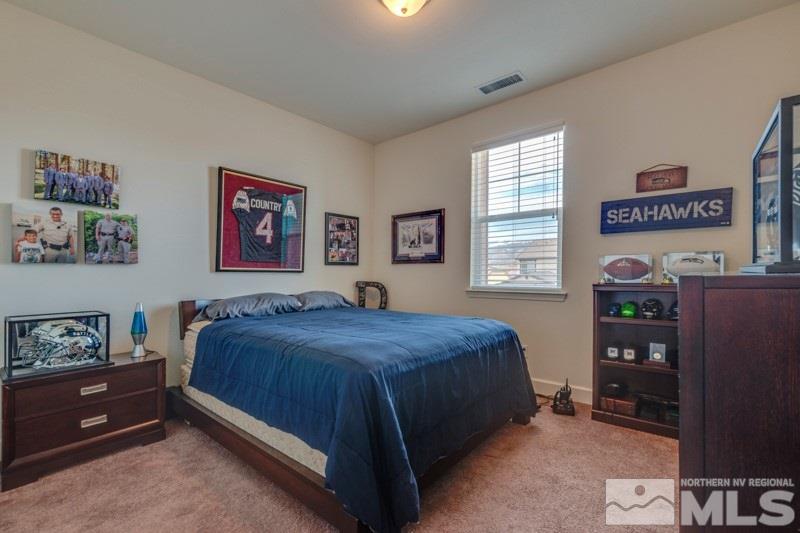 10602 Washington Reno, NV 89521 - Photo 21 of 25 a bedroom with a bed and a window