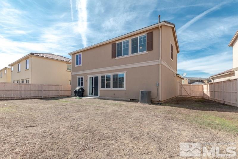 10602 Washington Reno, NV 89521 - Photo 24 of 25 a front view of a house with a yard