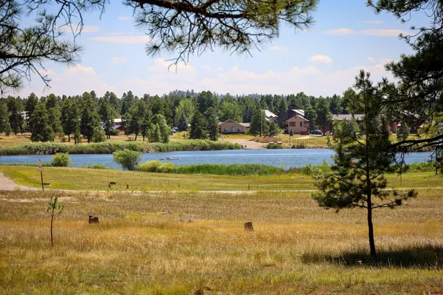 a view of a swimming pool with an outdoor space and seating area