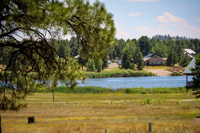 a view of swimming pool with an outdoor seating