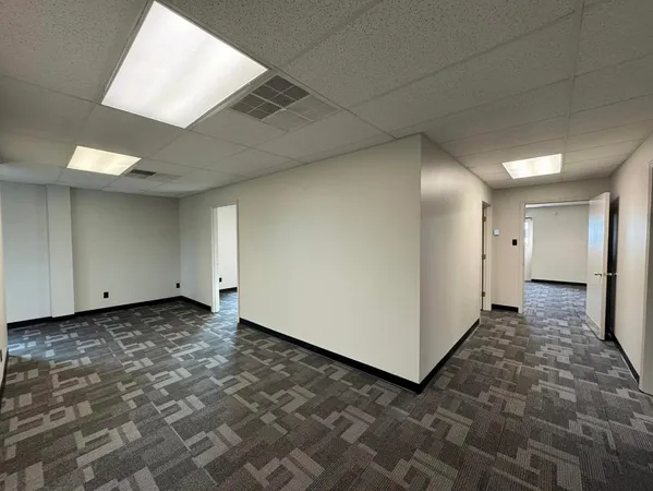 a view of a room with a hallway