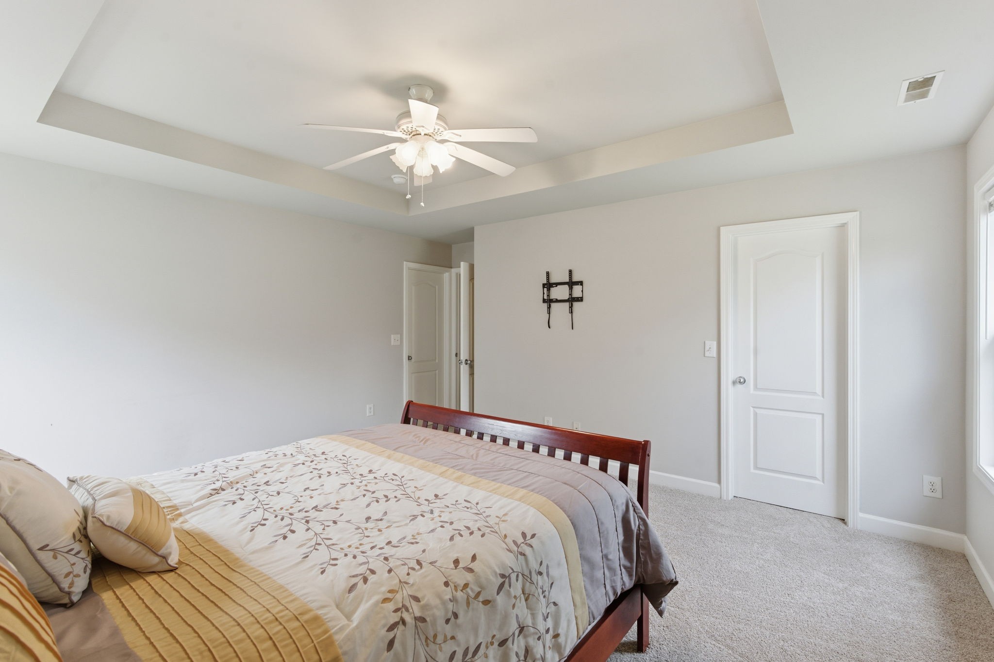2036 Sparrow Street Spring Hill, TN 37174 - Photo 11 of 25 a bedroom with a bed and a chandelier