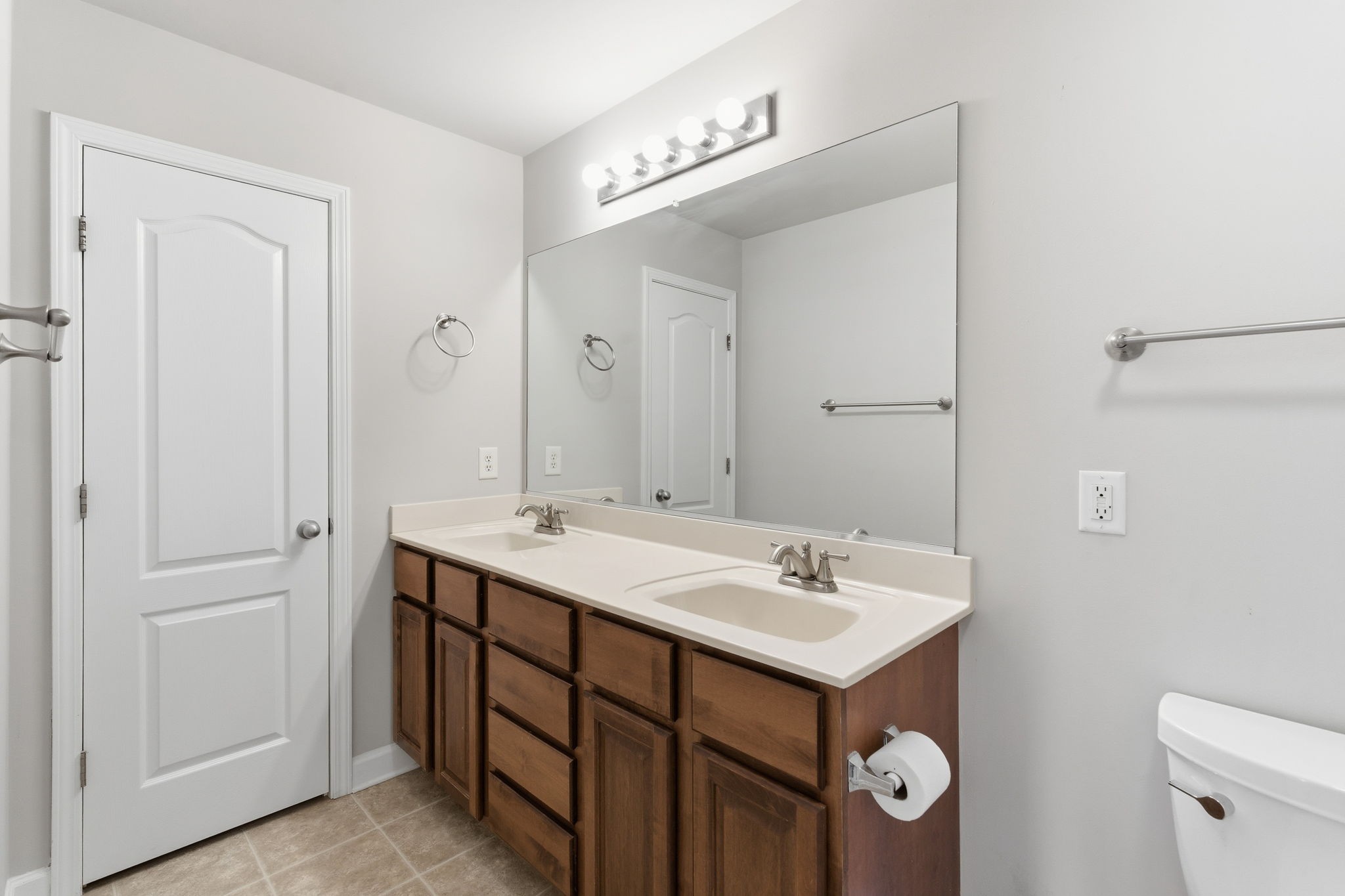 2036 Sparrow Street Spring Hill, TN 37174 - Photo 13 of 25 a bathroom with a sink mirror and toilet