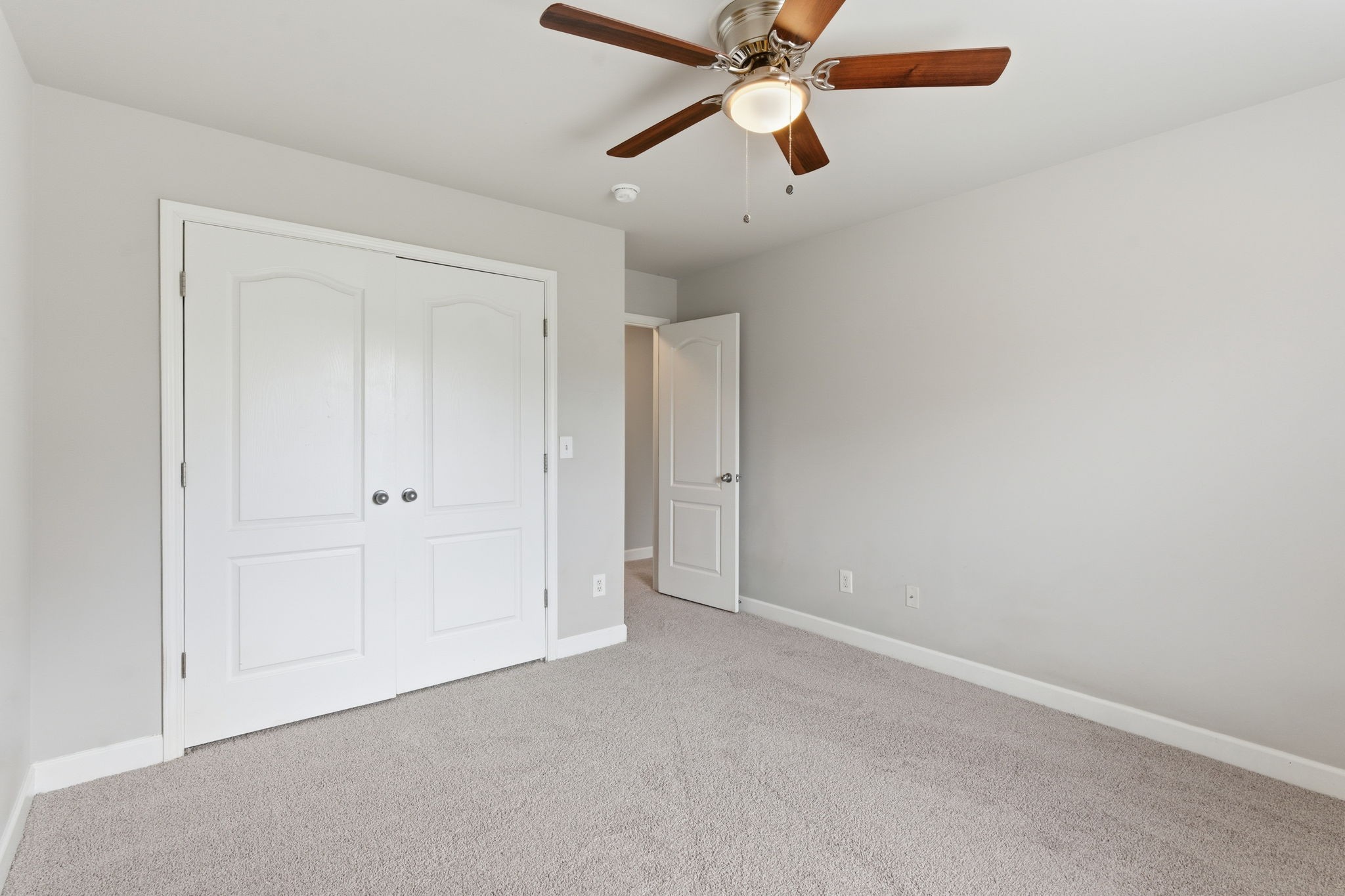 2036 Sparrow Street Spring Hill, TN 37174 - Photo 14 of 25 an empty room with closet and a chandelier fan