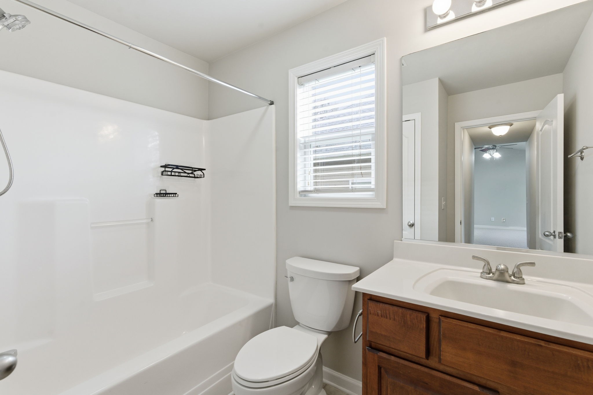 2036 Sparrow Street Spring Hill, TN 37174 - Photo 16 of 25 a bathroom with a sink a toilet and a bathtub