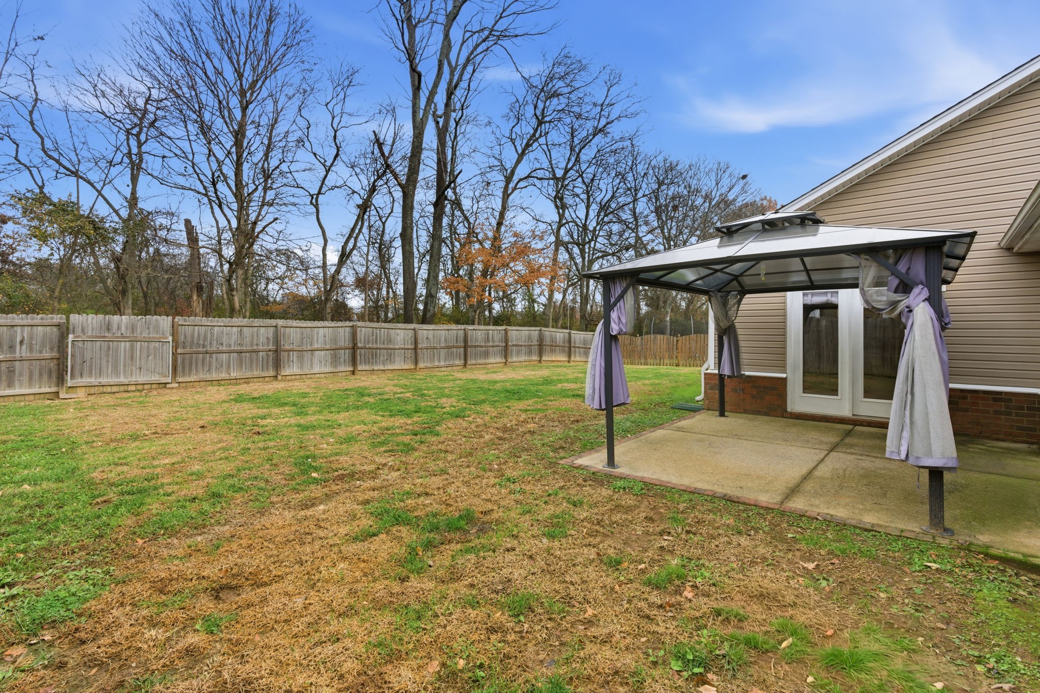 2036 Sparrow Street Spring Hill, TN 37174 - Photo 20 of 25 a view of a house with backyard and trees