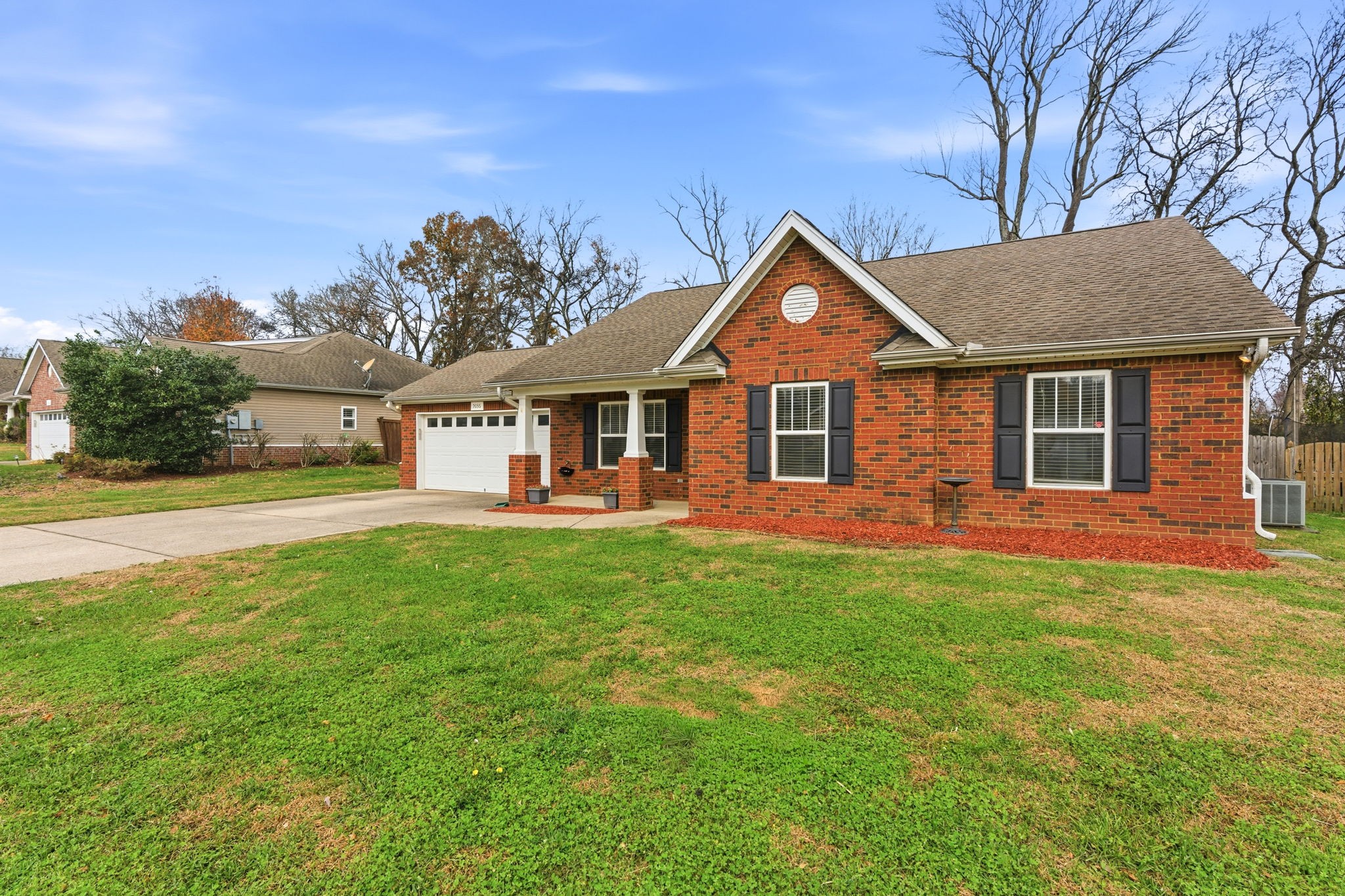 2036 Sparrow Street Spring Hill, TN 37174 - Photo 24 of 25 a front view of a house with a garden and yard