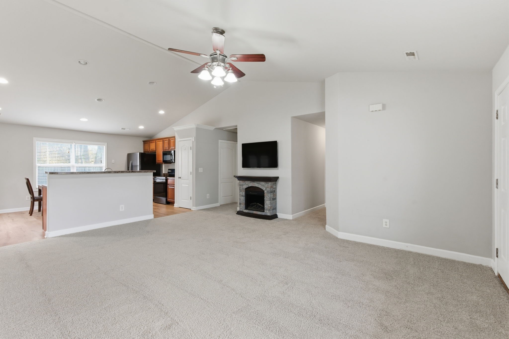 2036 Sparrow Street Spring Hill, TN 37174 - Photo 4 of 25 en view of an empty room with kitchen and a window