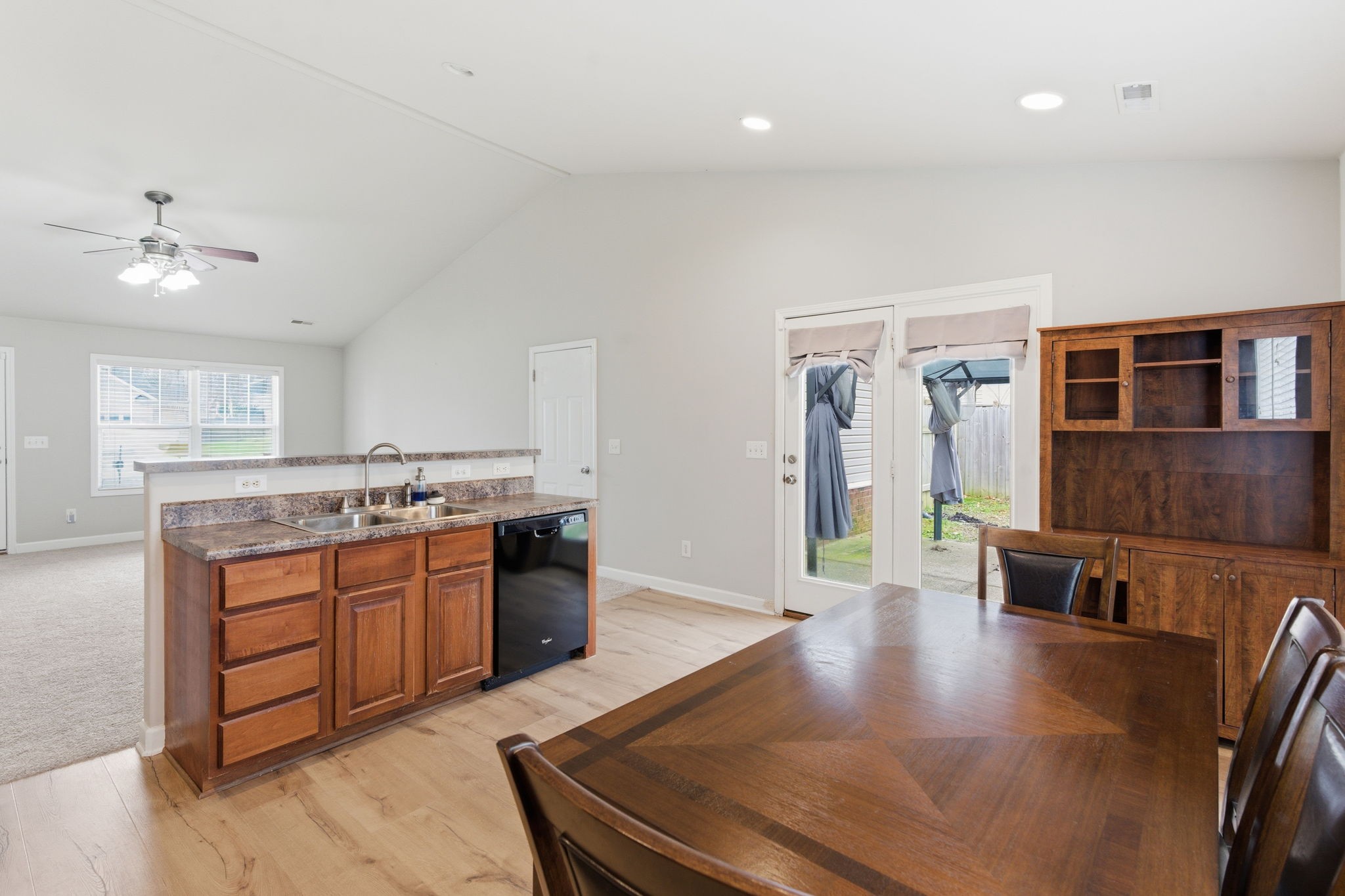 2036 Sparrow Street Spring Hill, TN 37174 - Photo 8 of 25 a large kitchen with stainless steel appliances granite countertop a stove and a sink with cabinets
