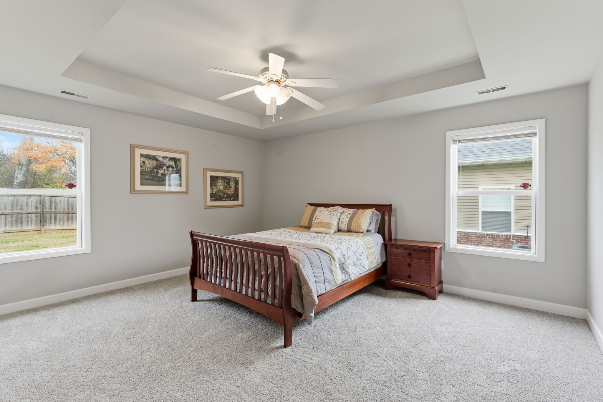 2036 Sparrow Street Spring Hill, TN 37174 - Photo 10 of 25 a spacious bedroom with a bed lamp and a window