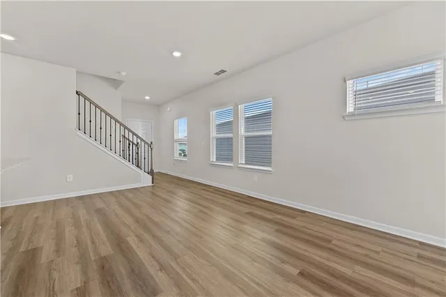 a view of gallery with wooden floor