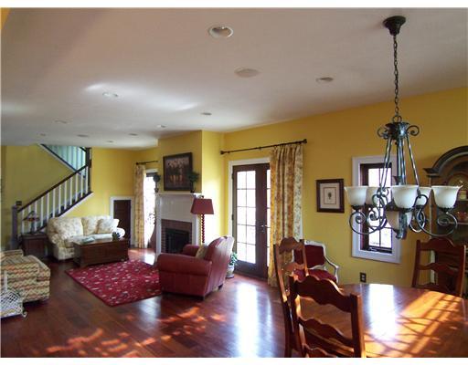 296 McCombs Road Venetia, PA 15367 - Photo 2 of 18 Living Room. The open livingroom and diningroom area flow iinto the kichen. Mahogany hardwood flooring and a gas fireplace add warmth to this spectacular space.