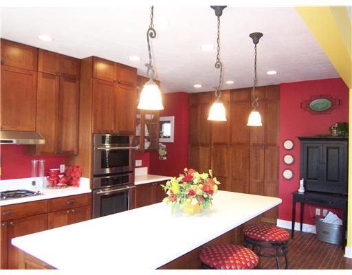 296 McCombs Road Venetia, PA 15367 - Photo 8 of 18 Kitchen. Large wall of pantry space. Pendent lights. Laundry room around the corner!