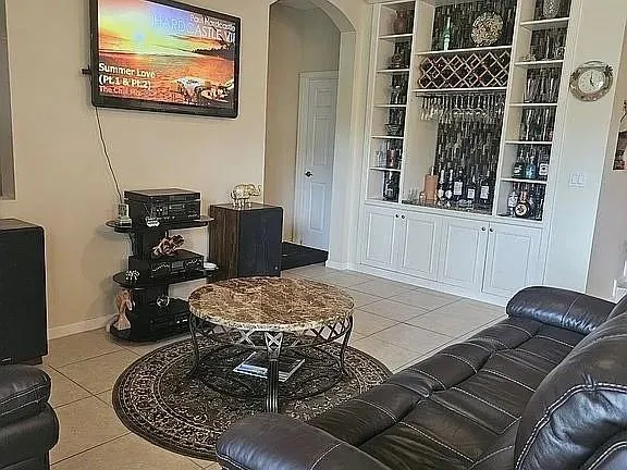 a room with furniture flowerpot and wooden floor