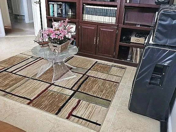 a vase of flowers sitting on a shelf