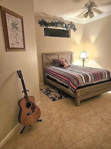 a bedroom with bed and window