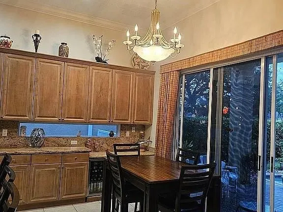 a kitchen with a sink cabinets and window