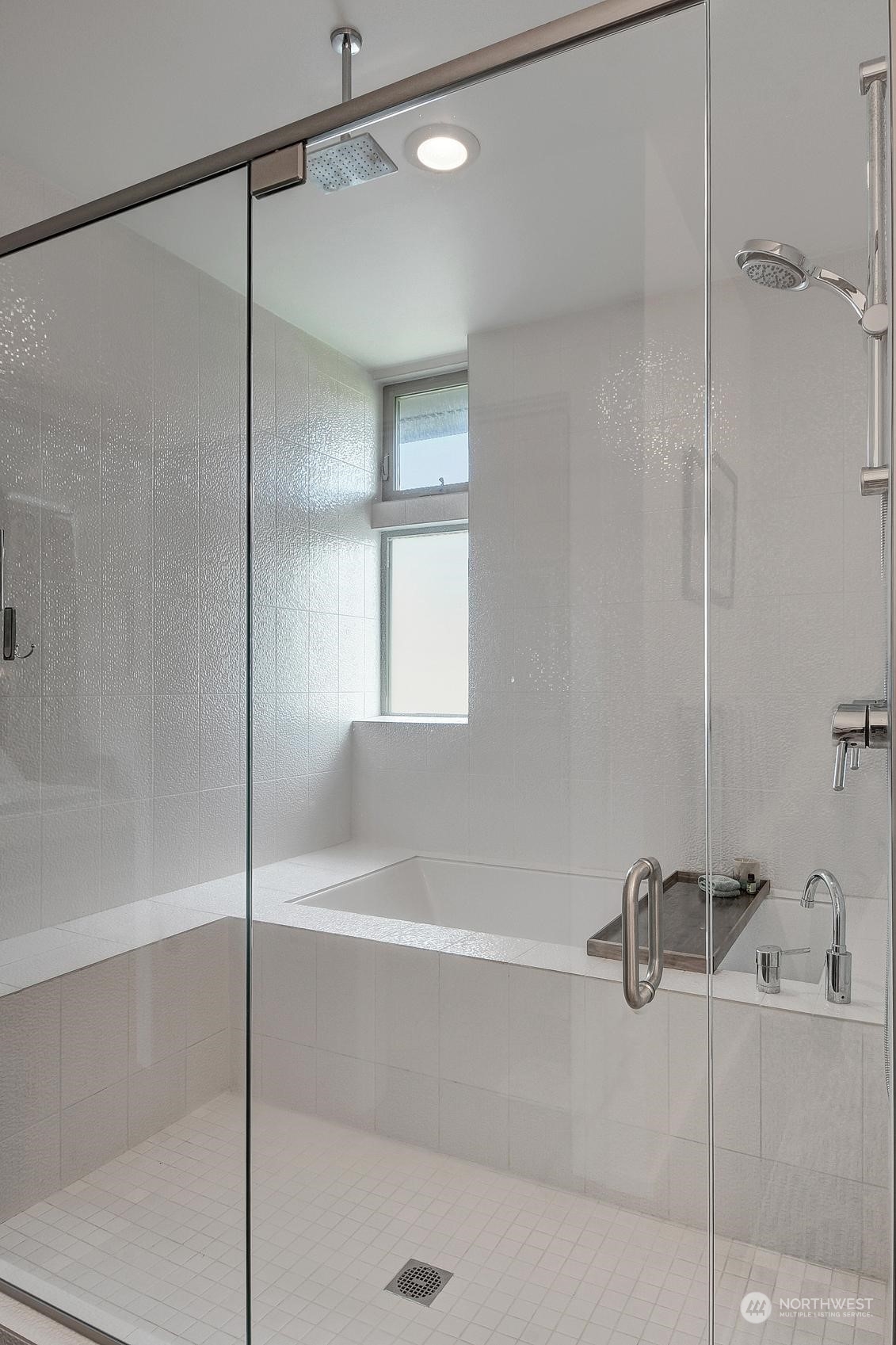 4412 Renton Avenue South Seattle, WA 98108 - Photo 11 of 23 a bathroom with a shower and a bath tub