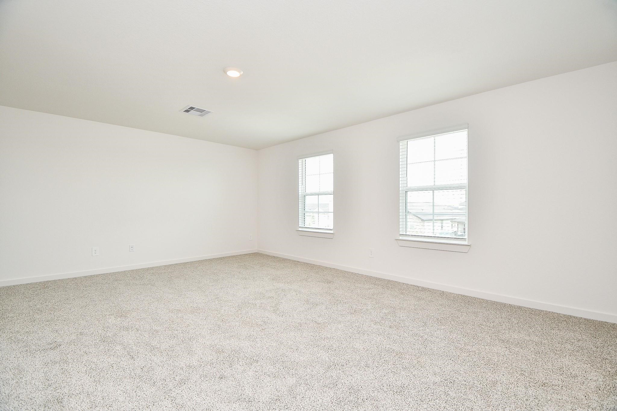 3930 Winterbourne Way Fulshear, TX 77441 - Photo 12 of 28 an empty room with windows