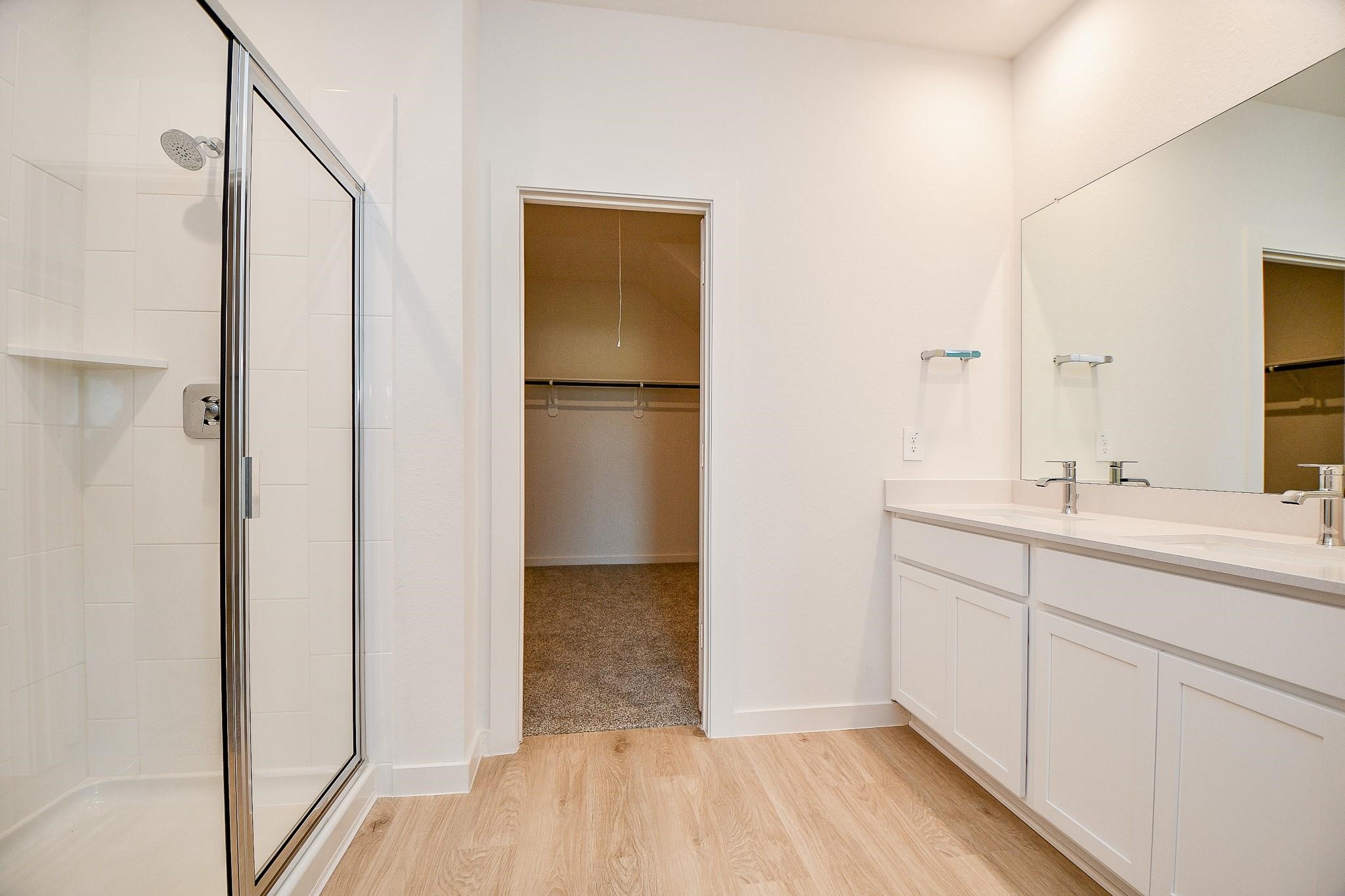 3930 Winterbourne Way Fulshear, TX 77441 - Photo 13 of 28 a bathroom with a sink and a mirror