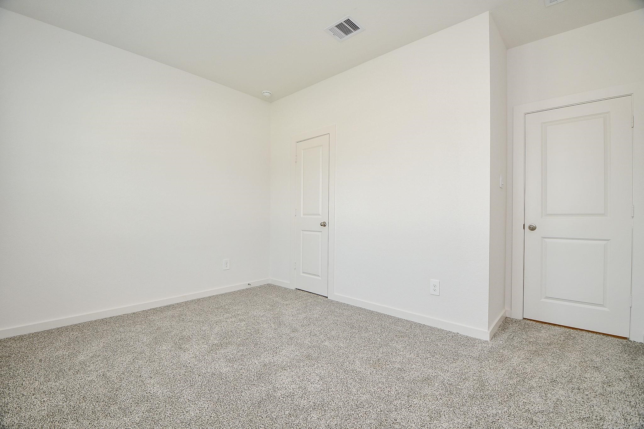 3930 Winterbourne Way Fulshear, TX 77441 - Photo 19 of 28 an empty room with an entryway