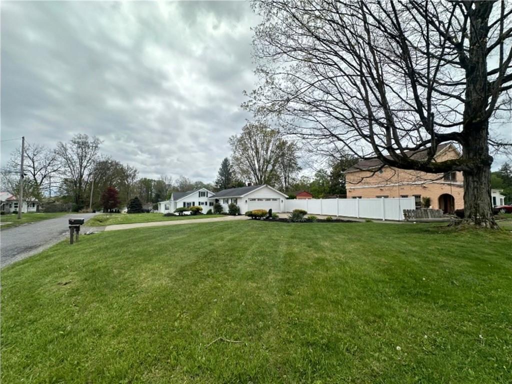 11753 Oakview Road Conneaut Lake, PA 16316 - Photo 22 of 23 a front view of a house with garden