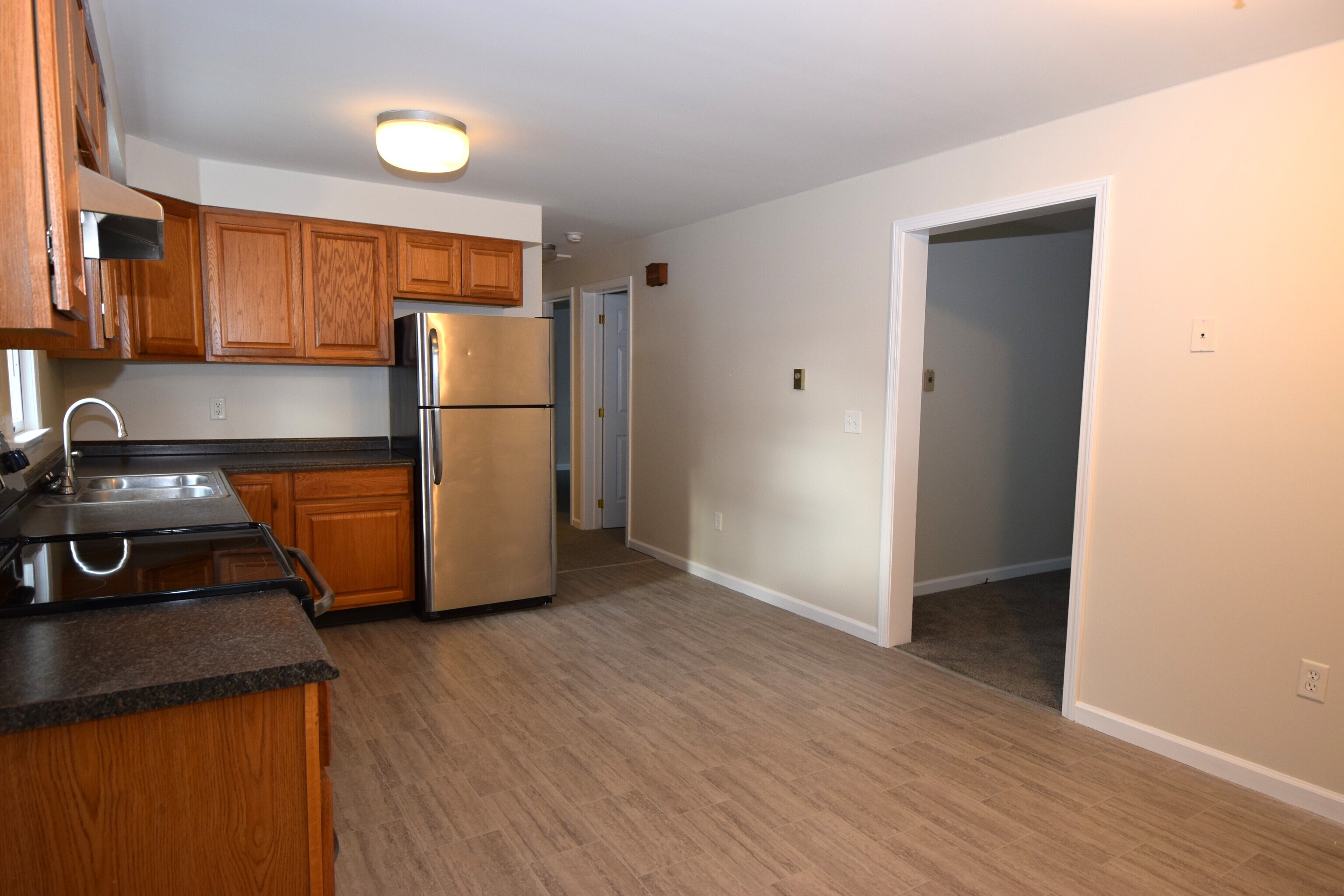7 Shelby Circle Killingly, CT 06241 - Photo 9 of 16 a kitchen with a refrigerator and a stove