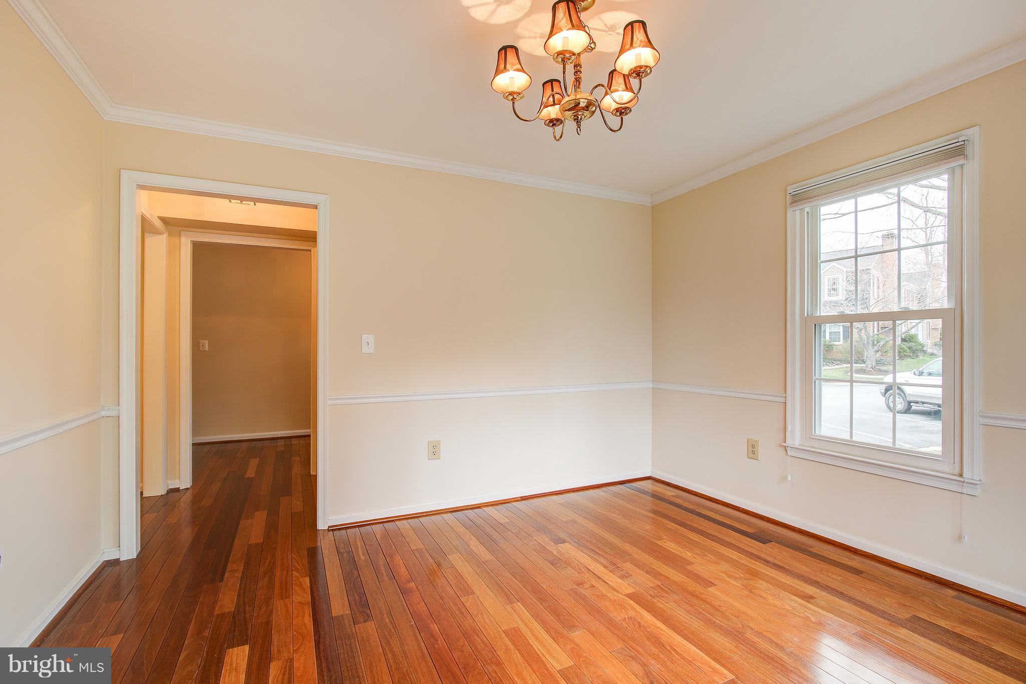 1030 Windrush Lane, Unit 31 Sandy Spring, MD 20860 - Photo 15 of 30 wooden floor in an empty room with a window