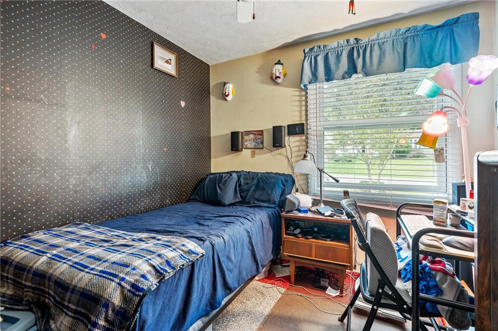 1528 O'Block Road Pittsburgh, PA 15239 - Photo 14 of 19 a bedroom with a bed and a window