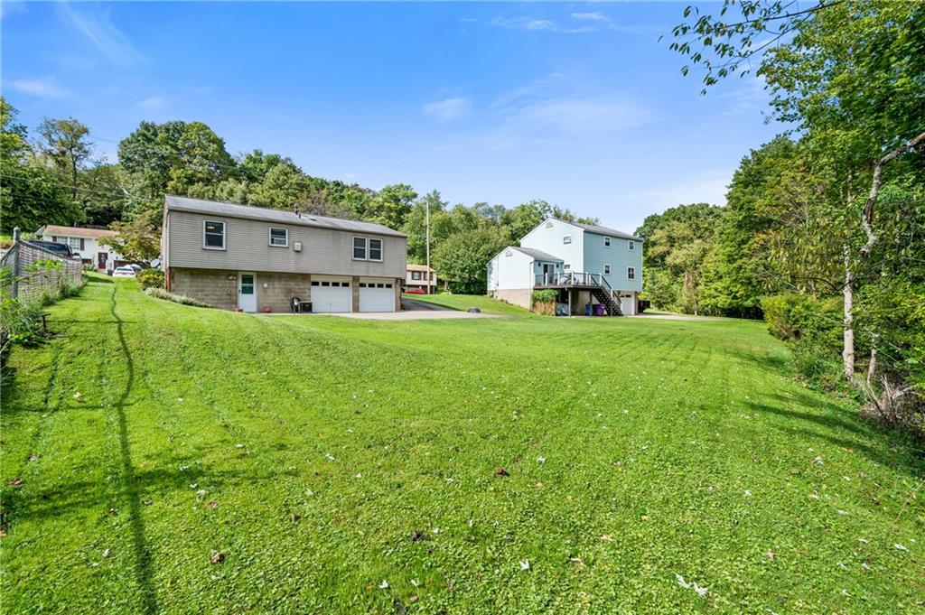 1528 O'Block Road Pittsburgh, PA 15239 - Photo 15 of 19 a view of a house with a big yard and large trees