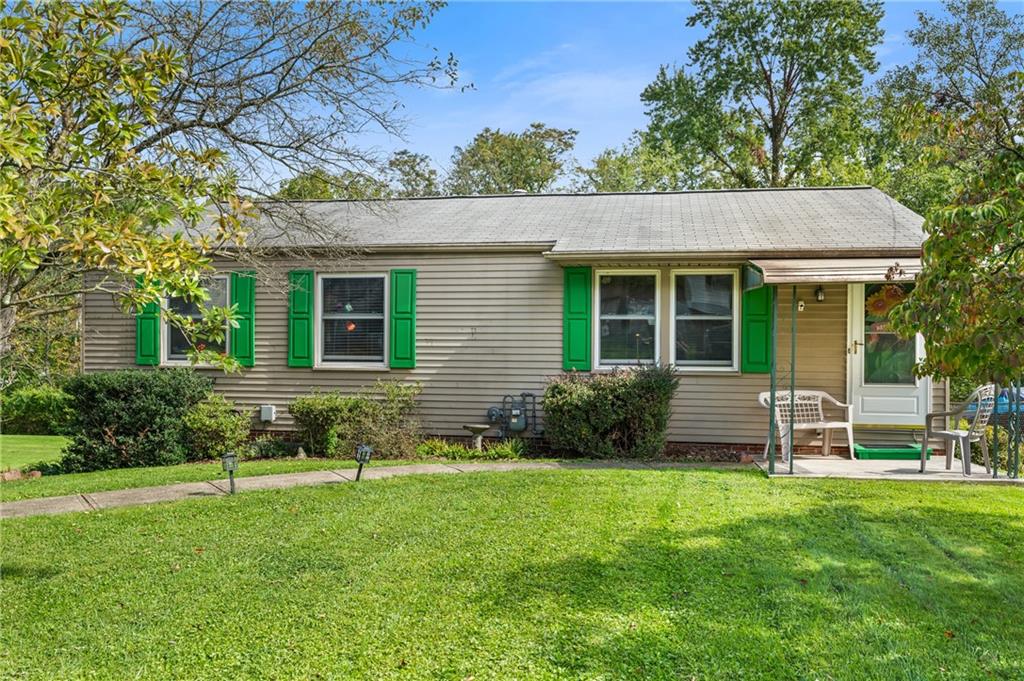 1528 O'Block Road Pittsburgh, PA 15239 - Photo 19 of 19 a view of a house with a yard and sitting area
