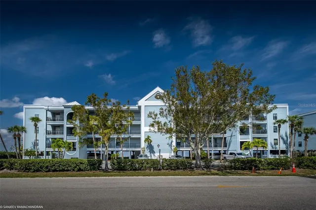 a city street lined with buildings and trees