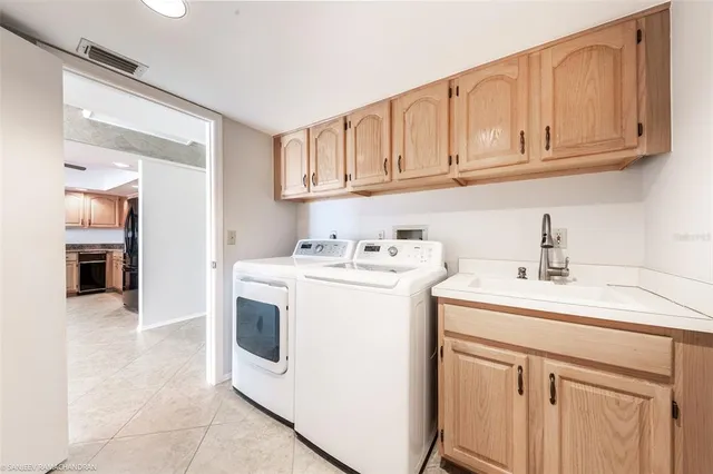 a view of a hallway view with wooden floor and a bathroom