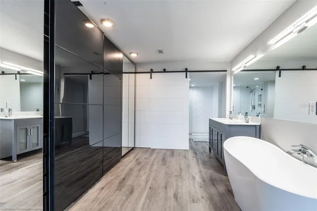 a bathroom with a bathtub and a sink