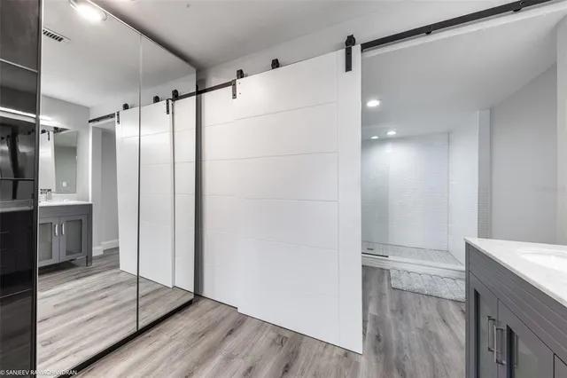 a bathroom with a sink double vanity and a mirror