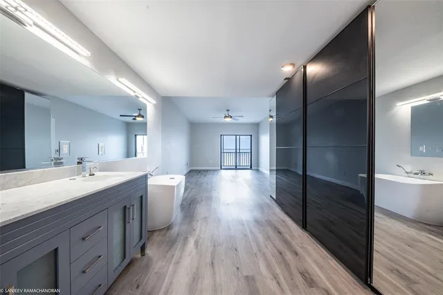 a bathroom with a double vanity sink and a mirror