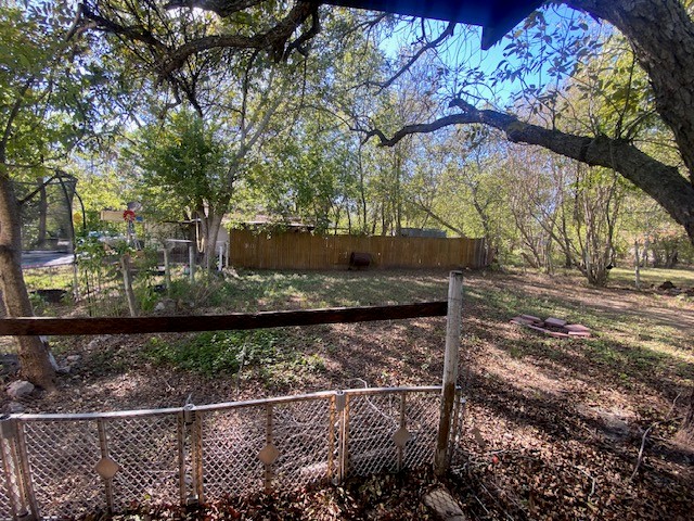 523 South Rio Grande Street Lockhart, TX 78644 - Photo 14 of 16 View of yard with a trampoline