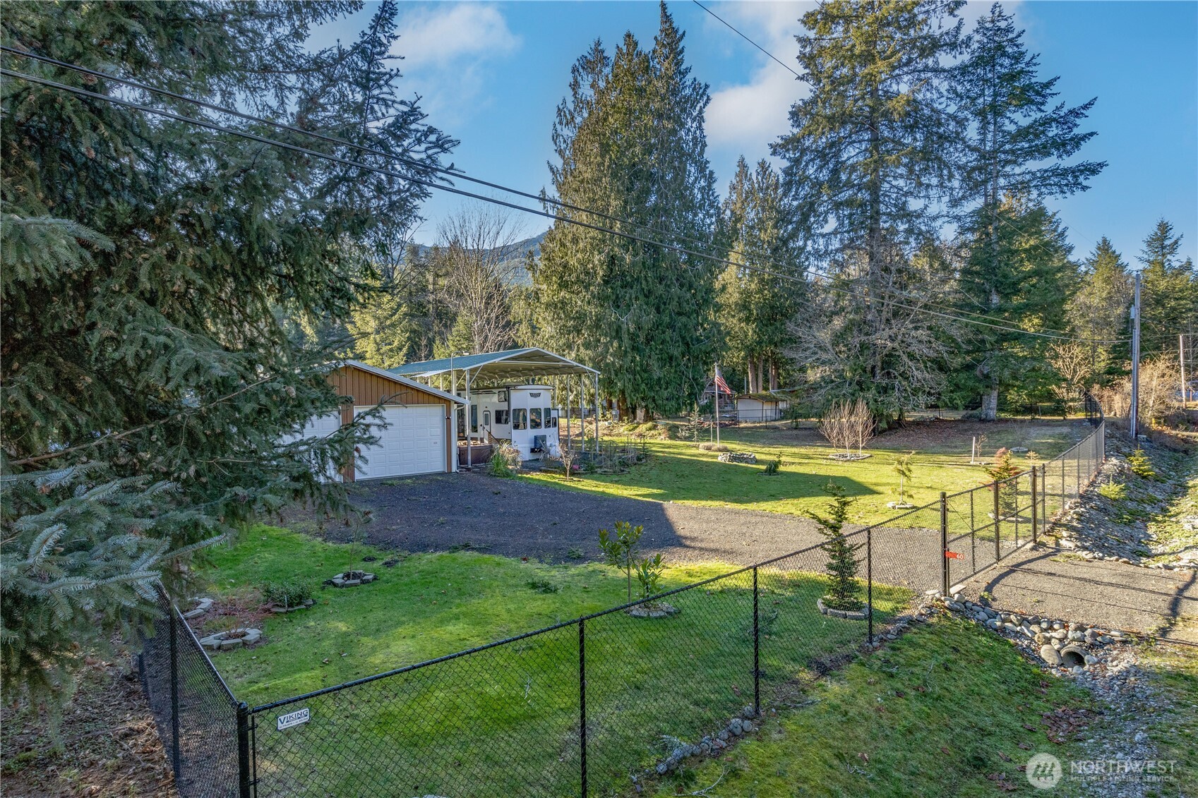 60 Pinto Lane Brinnon, WA 98320 - Photo 2 of 16 a view of a house with backyard and swimming pool