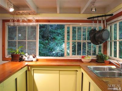 6655 St Helena Road Santa Rosa, CA 95404 - Photo 2 of 8 a kitchen with a sink and a large window
