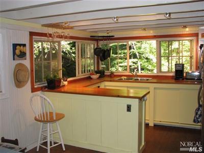 6655 St Helena Road Santa Rosa, CA 95404 - Photo 3 of 8 a dining table chair next to a window