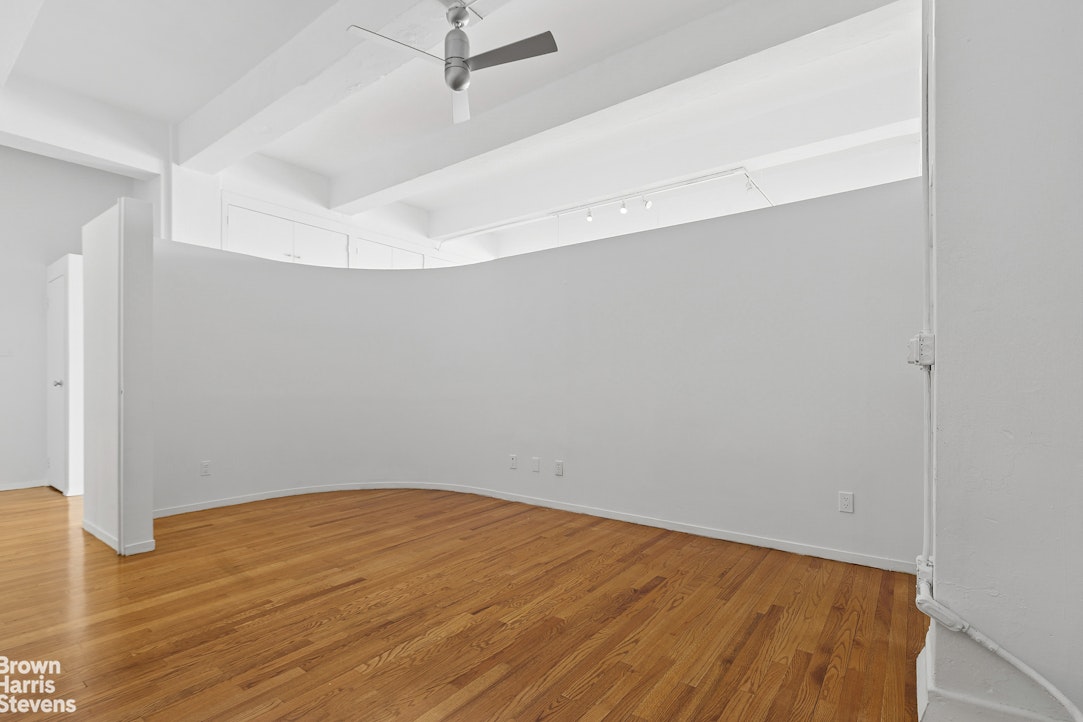161 West 15th Street, Unit 6B Manhattan, NY 10011 - Photo 10 of 14 a view of empty room with wooden floor