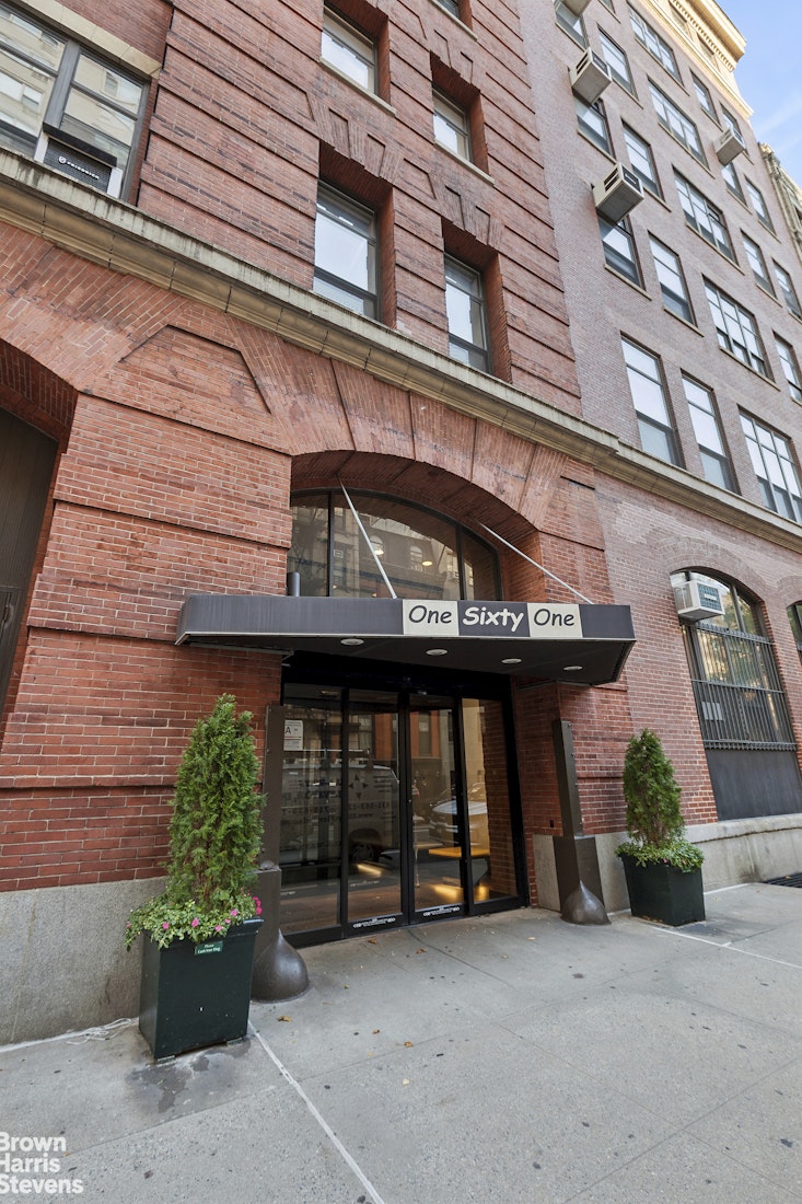 161 West 15th Street, Unit 6B Manhattan, NY 10011 - Photo 13 of 14 a view of a building with potted plants