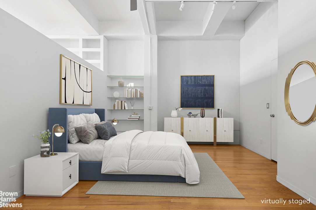 161 West 15th Street, Unit 6B Manhattan, NY 10011 - Photo 8 of 14 a bedroom with a bed couch and a window