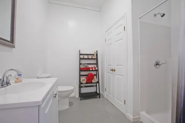 a bathroom with a sink toilet and vanity