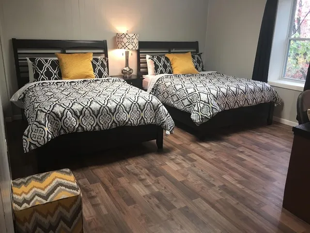 a bedroom with a bed and window