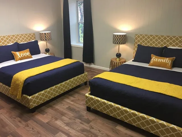 a bedroom with a bed and lamp